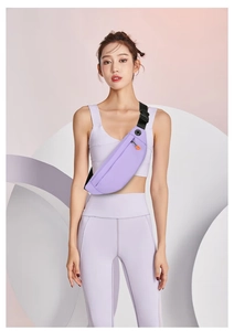 Detail of light purple waterproof running belt with earphone jack and orange zipper puller