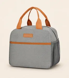 Gray insulated lunch bag with orange handles and side mesh pocket for water bottle