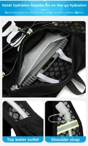 Detail of running hydration vest showing water bladder pocket and drinking tube exit