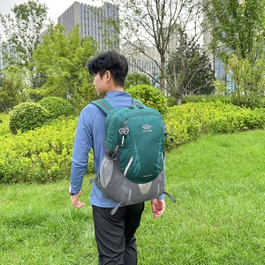 Outdoor hiking backpack in forest green with large capacity and multi-pocket design