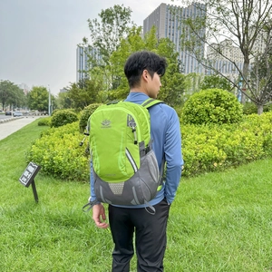 Outdoor sports hiking backpack in vibrant neon green and grey with reflective strips