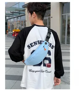 Detail of light blue waterproof running waist bag with adjustable strap and earphone port