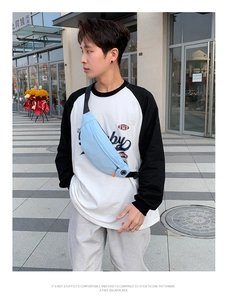 Detail of sky blue lightweight waterproof running waist bag with headphone port