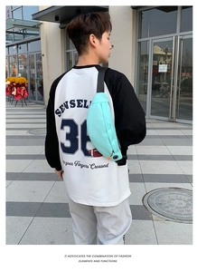 Detail of mint green waterproof sports waist bag with adjustable strap and headphone port