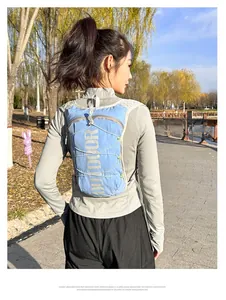 Close-up of a light blue nylon running vest with reflective straps in outdoor scenery