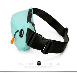 Macro detail of mint green sports waist bag featuring earphone hole and durable buckle