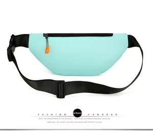 Detail view of the mint green sports waist bag back with adjustable strap and buckle