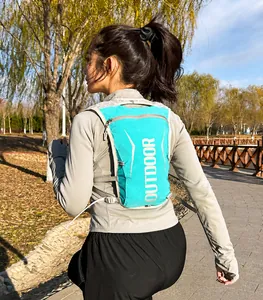 Detail of adjustable Duraflex buckles and mesh fabric on teal hydration running vest