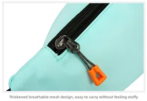 Detail of breathable mint green mesh fabric and sturdy stitching on sports waist bag