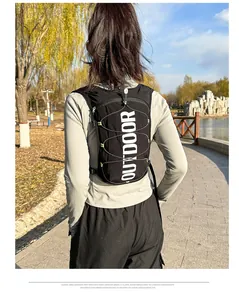 Rear view of a black lightweight running vest with reflective OUTDOOR text and bungee cords