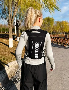 Rear view of lightweight black nylon hydration vest showing outdoor print and adjustable straps