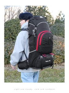 Outdoor 80L large capacity hiking backpack with red zipper accents on durable black fabric