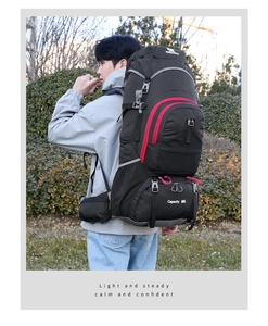 Side view of an 80L large capacity outdoor hiking backpack worn by a male model