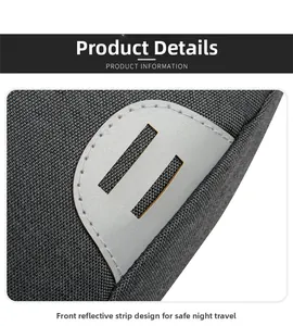 Detail of the gray Oxford fabric cross-body bag featuring a dual-hole safety reflective strip