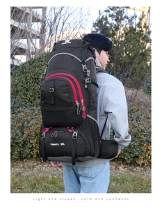Macro detail of 80L hiking backpack with breathable padded straps and waist support pads