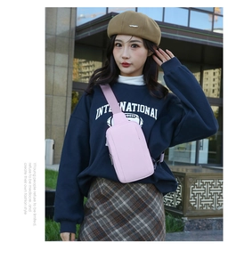 Pink PU leather crossbody chest bag shown on model for casual outdoor travel style