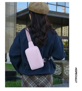 Waterproof lavender crossbody chest bag worn by a model in an urban outdoor setting