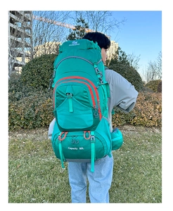Outdoor shot of 80L hiking backpack with thick waist straps and adjustable gear loops