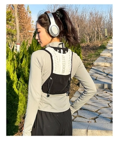 Close-up of lightweight breathable mesh running vest with Outdoor print on the back