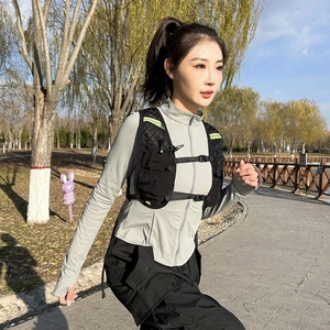 Black lightweight running vest with neon reflective strips and adjustable chest buckles