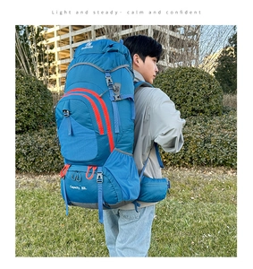 Outdoor 80L hiking backpack detail featuring blue tear-resistant fabric and buckles