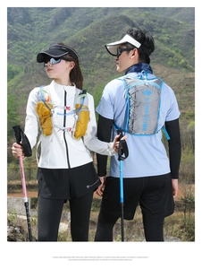Outdoor hydration vest for trail running and hiking with trekking poles and sun cap