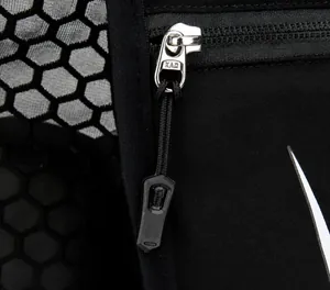 Detail of durable metal KAM zipper and honeycomb mesh on nylon hydration backpack