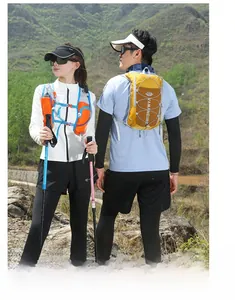 Outdoor hydration vest and hiking poles used by two people in a mountain scenery view