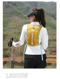 Outdoor view of a yellow sports backpack with gray straps and elastic bungee cords