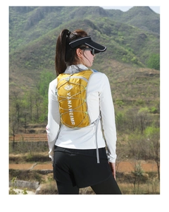 Outdoor athlete wearing a yellow hydration pack for trail running and mountain hiking