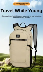 Close-up of lightweight foldable beige hiking backpack with mesh pockets on natural background