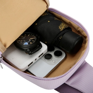 Waterproof lavender crossbody bag showing large interior space for daily essentials