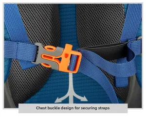 Detail of the blue hiking backpack showing an orange survival whistle buckle on chest strap