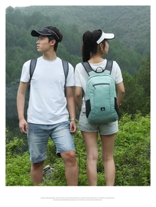 Detail of mint green lightweight waterproof outdoor backpack with mesh side pockets