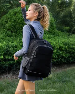 Close-up of lightweight foldable backpack with mesh side pockets and reflective safety strip