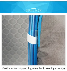 Detail of shoulder strap elastic webbing securing a blue water tube on gray hiking pack