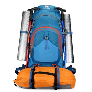 Blue 80L large capacity hiking backpack with silver sleeping pads and trekking poles