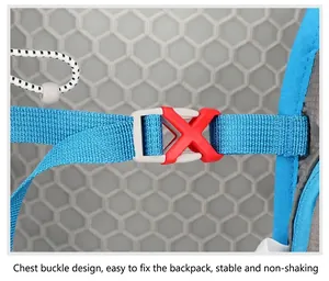 Close-up of chest buckle with red plastic clip and blue nylon straps on cycling backpack