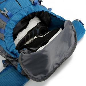 Blue hiking backpack with a bottom shoe compartment for outdoor sports and travel gear