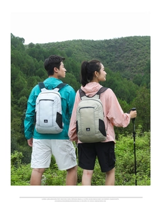 Detail of lightweight hiking backpacks in grey and khaki with waterproof nylon fabric