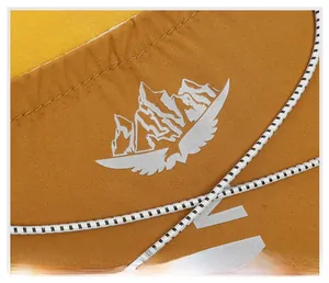 Macro shot of mountain logo and elastic drawstring on waterproof cycling backpack