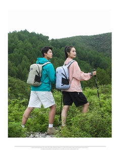 Hiking backpacks in blue and khaki shown on models during mountain trekking