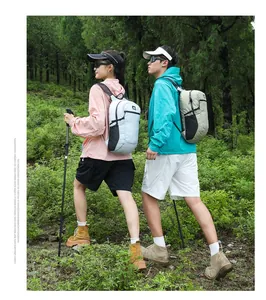 Outdoor hiking scene featuring lightweight gray and green backpacks with trekking poles