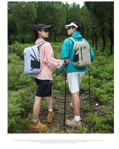 Outdoor hiking backpack in light blue and khaki colors featuring side mesh pockets