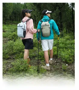 Close-up of lightweight hiking backpacks with mesh straps in an outdoor forest setting