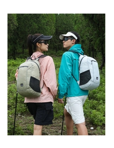 Lightweight water-resistant hiking backpack for outdoor sports in a natural forest setting