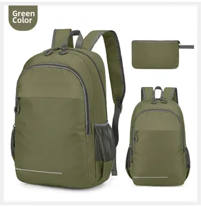 Detail view of foldable green outdoor backpack with tear-resistant fabric and safety reflectors