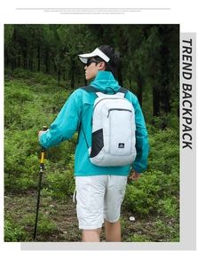 Outdoor waterproof hiking backpack with side mesh pockets and adjustable straps in forest
