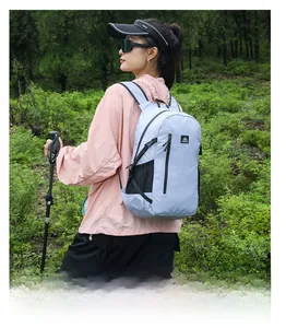 Close-up of lightweight light blue hiking backpack featuring AZZLA logo and mesh side pocket