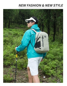 Hiking backpack in khaki shown outdoors featuring adjustable straps and mesh side pockets
